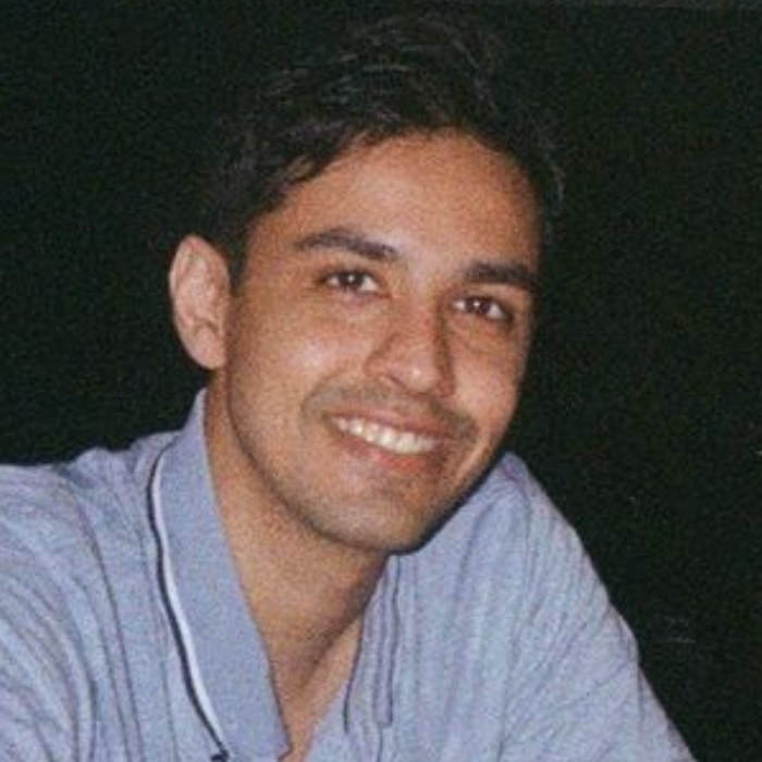 Nitish Sahni smiling at a table